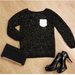 Juodas blizgantis megztinis