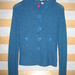Šviesiai mėlynas megztinis 