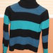 Siltas dryzuotas megztinis