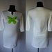 Nauja balta suknelė su žaliu drugeliu