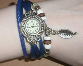 Mėlynas laikrodukas su plunksnele/lapeliu (naujas)