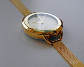 Calvin Klein auksos spalvos laikrodis.