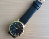 Naujas juodas laikrodis