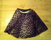 Leopardinis nuostabiai krentantis sijonas.