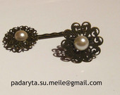 segtukas ir žiedas su perlais
