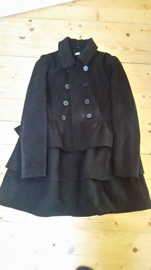 Juodas nešiotas paltukas