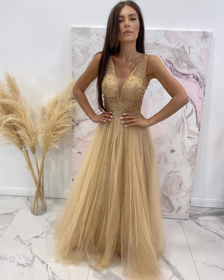 Nauja progine auksine suknele