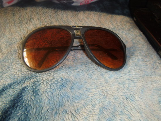 rudi akiniai nuo saulės