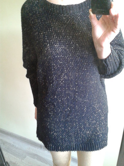 Laisvo stiliaus šiltas megztinis